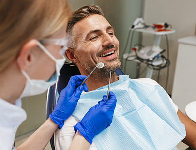 Man in beard waiting for dentist to start treatment