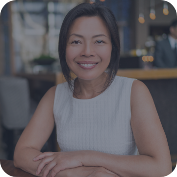 Woman sitting at table and smiling