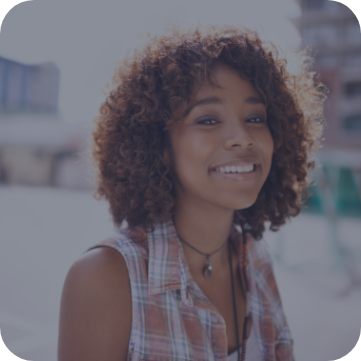 Woman walking outside and smiling